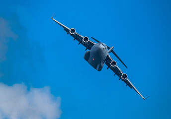 McDonnell Douglas/Boeing C-17 Globemaster III American Air Force cargo plane flying against sky