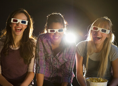 Young girls watching 3D movie
