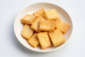 Crispy bread butter sugar on white.