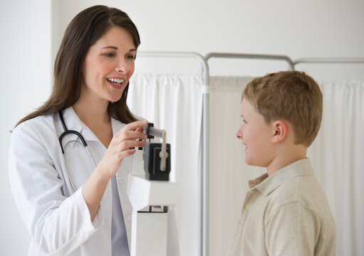Young boy and doctor in examination room