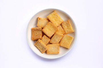 Crispy bread butter sugar on white.