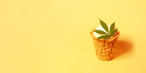 Ice cream with cannabis leaf. Marijuana infused dessert. Summer food. Copy space