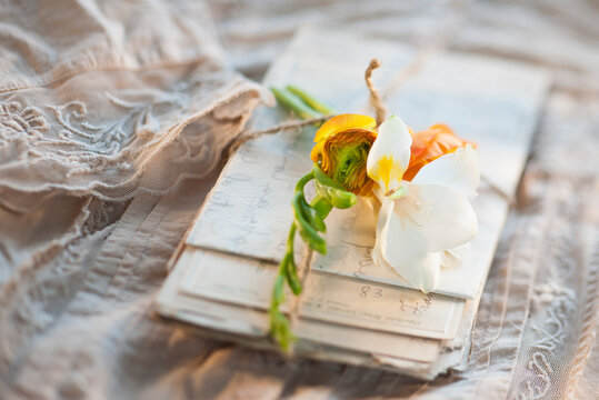 Flowers on pile of letters