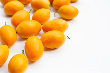 Marian plum fruit isolated on white.