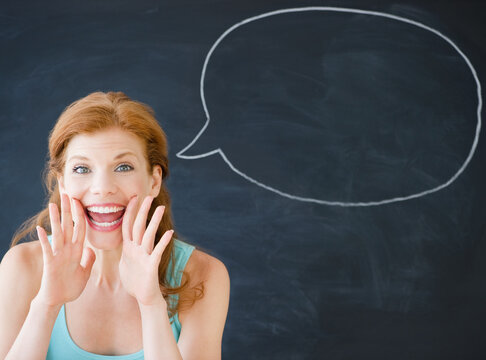 Woman standing in front of a speech bubble