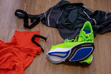 Gym equipment - training clothes, running shoes and heart rate monitor