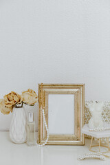 Feminine Mockup vintage gold frame and candle. Wedding still life. Cozy Aesthetic Background. Parisian chic