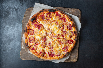 pizza salami double cheese sausage or pepperoni spicy fast food healthy meal top view copy space for text food background rustic image