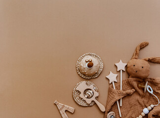 Newborn accessories with decoration over brown background. Baby shower, birthday, Top view flat lay