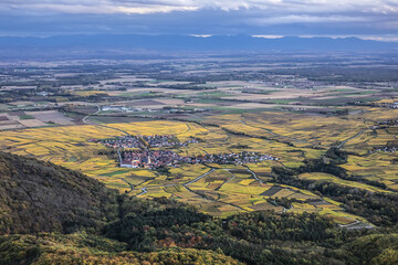 Picturesque French landscape - aerial view Alsatian plain from the Haut-Koenigsbourg Castle. Valley, small towns and mountains in the background in the Bas-Rhin departement of Alsace, France.