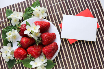 ripe fresh strawberries on a white dish 
