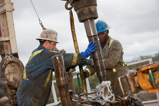 Oil workers drilling for oil on rig