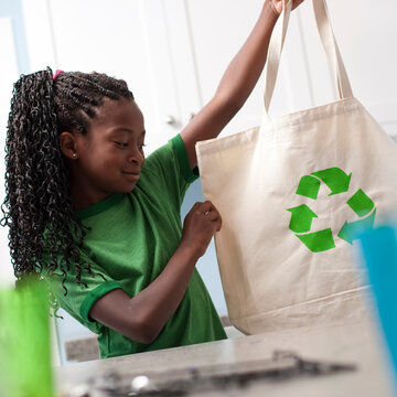 Young Girl Holding Reusable Shopping Bag