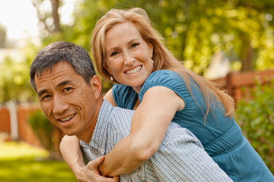 USA, Utah, Provo, Portrait of smiling mature couple in garden