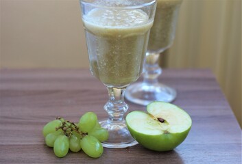 green apple and kiwi smoothie in glass. healthy fresh breakfast
