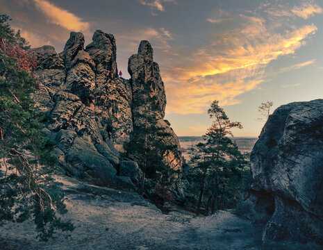 Beautiful sunset cloudscape over rough immense rock formations in Hamburger Wappen, Timmenrode
