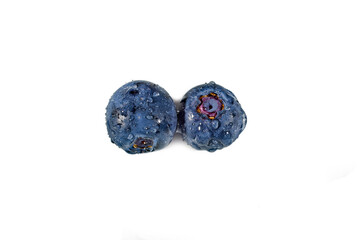 Blueberry with waterdrops isolated on a white background.