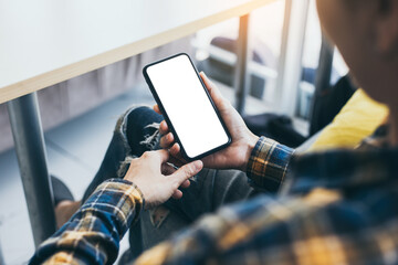 cell phone blank white screen mockup.woman hand holding texting using mobile on desk at office.background empty space for advertise.work people contact marketing business,technology