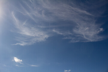 Naklejka na ściany i meble Beautiful white clouds on the blue sky. Resource for designers.