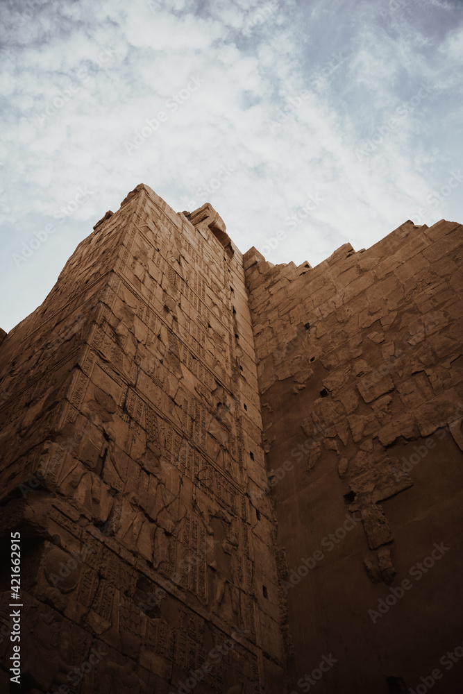 Sticker Low angle shot of the walls of the Luxor Temple under the sunlight in Egypt