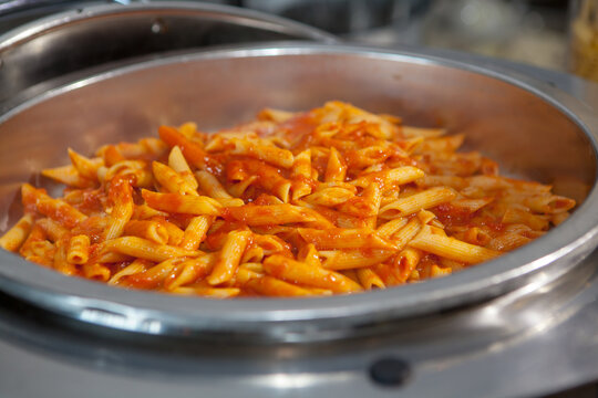 Selective Focus Shot Of Pasta With Red Sauce In The Metal Boiler