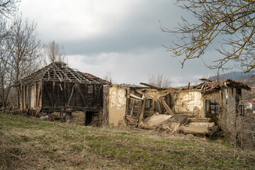 Ruined house devastated traditional serbian home in village collapsed and abounded with no people - rural scene depopulation concept