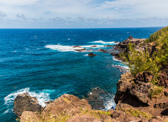Fototapeta na wymiar Waves Crashing Against The Rocky Shoreline of Papanalohoa Point, Maui, Hawaii, UISA