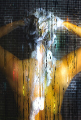 A Beautiful Woman washing her hair in the shower with steaming glass