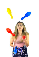 Beautiful woman juggling bowling pins