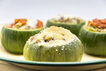zucchini stuffed with meat and a variety of sauces