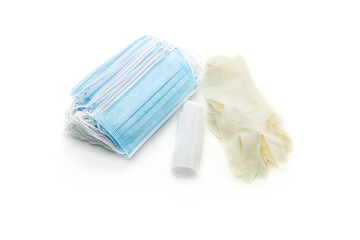 Medical masks, disposable gloves and antiseptic in a bottle close-up