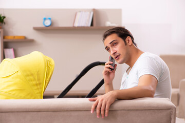 Young male contractor looking after new born at home