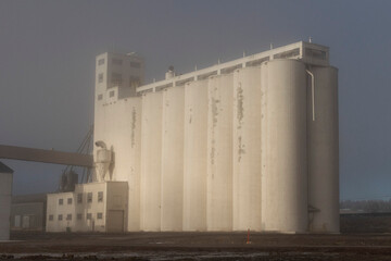 A grain storage building greets a foggy winter morning in Southern Oregon.