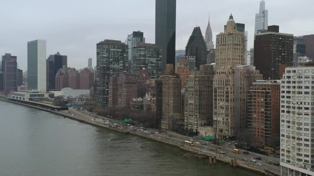4K Aerial NYC Commuter cars on FDR drive near United Nations overcast cloudy day