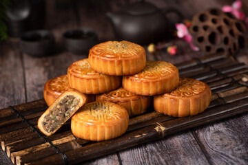 Chinese Mid-Autumn Festival moon cake on wooden background