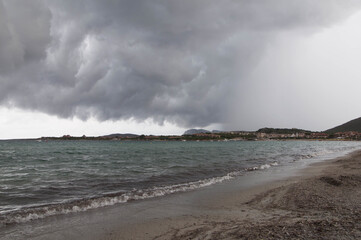 View of storm clouds on the beach in Golfo Marinella Sardinia, Italy