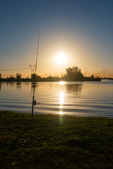 78 / 5000.Resultados de traducción.fishing rod in beautiful river of Argentina at sunset with a beautiful landscape