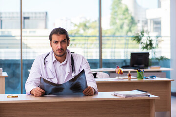 Young male doctor radiologist working in the clinic