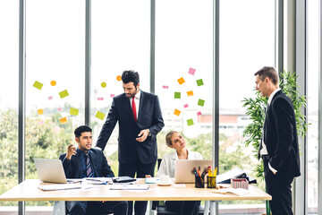 Group of professional business meeting and discussing strategy with new startup project.Creative business people planning and brainstorm with laptop computer in modern office.Teamwork concept