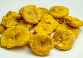Fried crushed green plantain, toston, patacon, fried green. © Mario