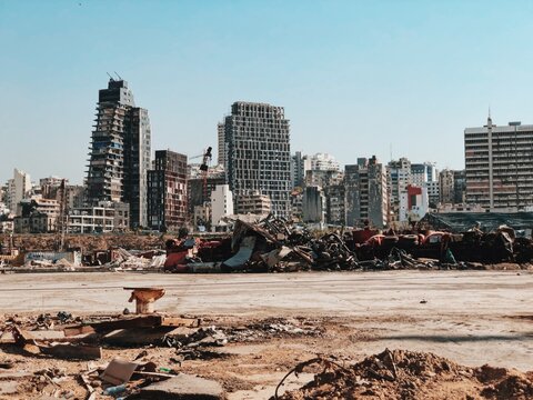 Destroyed Cars From The Beorut Explosion With Destroyed City Skyline Against Clear Sky