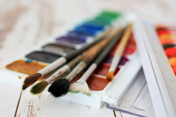 Paints, pastels and brushes for the artist