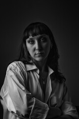 Black and white portrait of a young beautiful dark-haired girl.