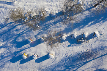 beehives covered with snow in winter, aeriaL - 421689107