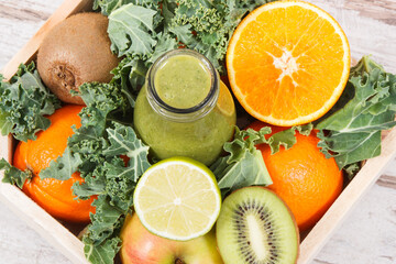 Freshly blended green coctail from fruits and vegetables. Diet and healthy nutrition concept