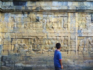 man standing on relic wall