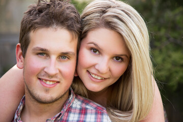 Close-up of a happy young couple outdoors. Shallow depth of field.