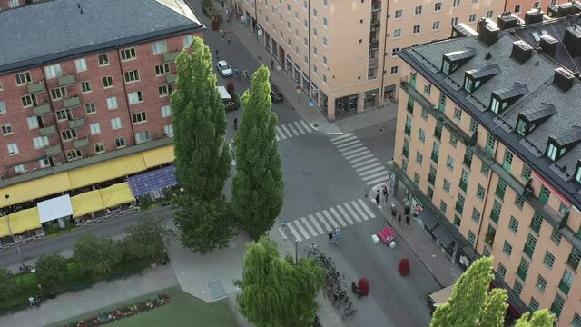 People at Nytorget square, Stockholm summer evening aerial view