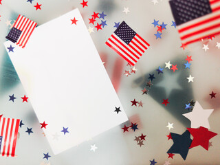 July 4, happy independence day. The concept of memory, patriotism and freedom. American flags, confetti of white blue red stars on a white background