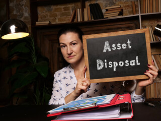 Financial concept meaning Asset Disposal with inscription on black chalkboard.